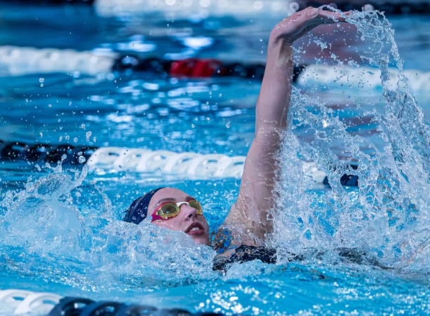 Senior Grace Toland swimming
